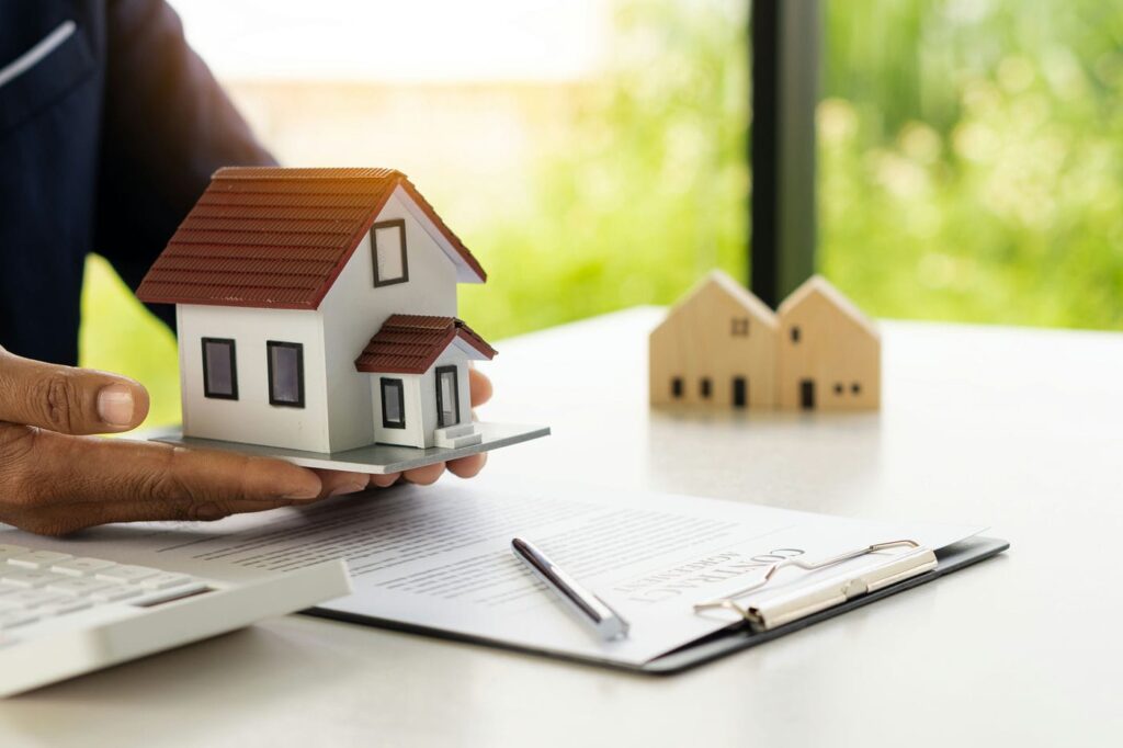 lawyer holding model house