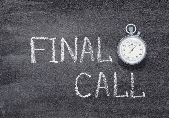 final call phrase written on chalkboard with vintage precise stopwatch