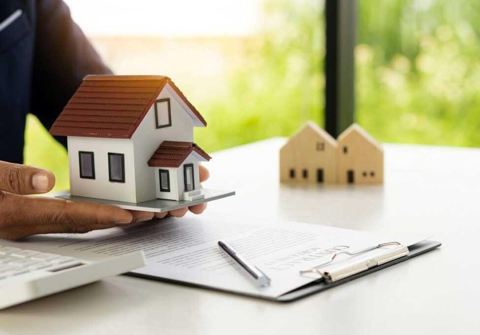 lawyer holding model house